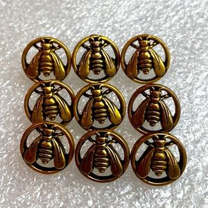Vintage lot of 9 metal bee buttons with self shank